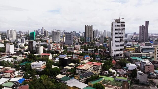 Aerial cinematic forward shot showing hotels under clouds and tropical light