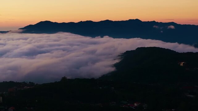 Baguio Benguet Philippines sunrise drone flying sideways above sea of clouds