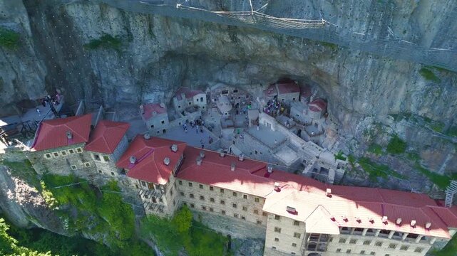 Altindere, Trabzon Province, Turkey. Sumela Monastery. Altindere Valley Park. Coniferous forest on the slopes. Aerial View, Departure of the camera