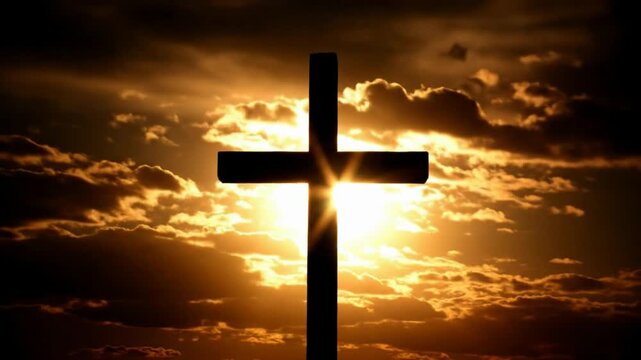 A cross stands tall against a dramatic sunset sky with radiant sunbeams and silhouetted clouds