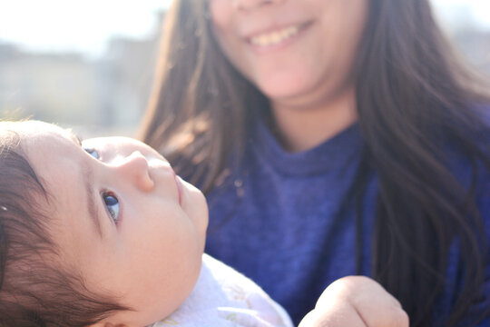 Tender portrait of two latin siblings with big age difference.
