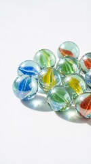 Colorful Transparent Glass Marbles on White Background with Bright Reflections