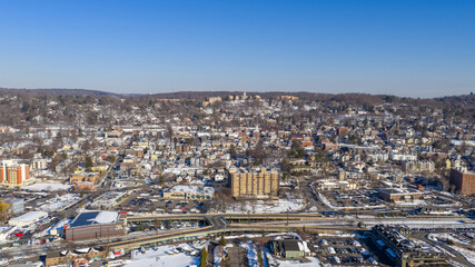 Winter aerial view showing high density housing, commercial buildings, infrastructure, and roads...