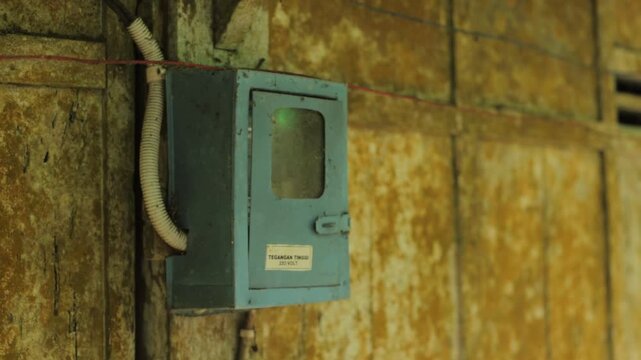 Antique electric meter or kWh meter for home electricity. Antique. Traditional nuance, rural atmosphere of Java Indonesia