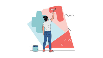 Woman with her hair in a bun stands back to the camera and uses a paint roller to apply red paint to a wall with abstract shapes.