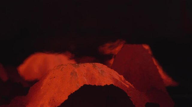 Dark Factory Scene With Glowing Waste. Photo Of Sparkling Debris Beneath Shadowy Factory Setting. Stock clip
