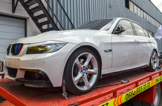 Pristine white BMW 3 Series (E90), revered platform within the automotive tuning culture  is the fifth generation of BMWs quintessential compact executive sedan