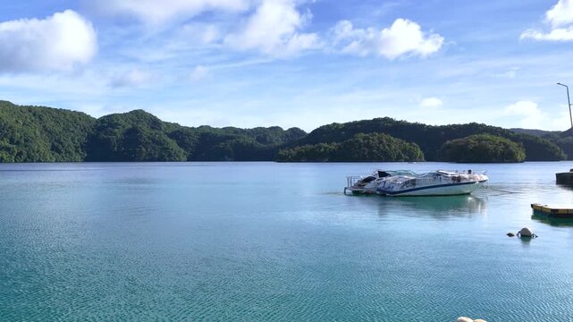Speed Boat Cruising Through Turquoise Lagoon in Palau Micronesia