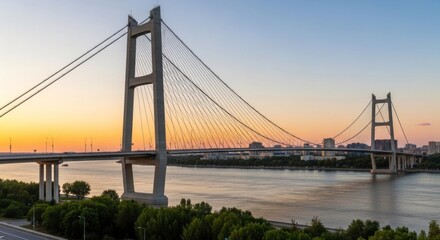 Obraz premium A serene river scene with a bridge spanning the water, a bridge with a clock tower in the background, and a boat on the water.