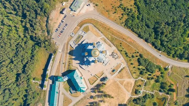 Russia, Perm region. Belogorsk St. Nicholas Missionary Monastery. Cathedral of the Exaltation of the Holy Cross in Belogorsk Nicholas Monastery. Drone footage, HEAD OVER SHOT with rotation
