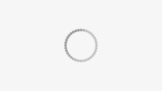 Rotating dots encircle center on light gray field