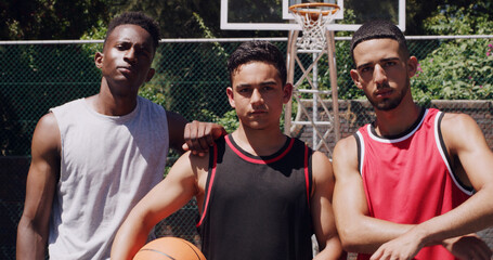 Confidence, portrait or people on basketball court with ball, fitness hobby or teamwork in weekend match. Pride, collaboration or men with roundball, hoop competition or training support in New York © peopleimages.com