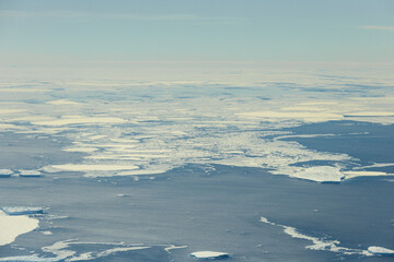 Aerial view of Antarctic Ocean with ice sheets.
