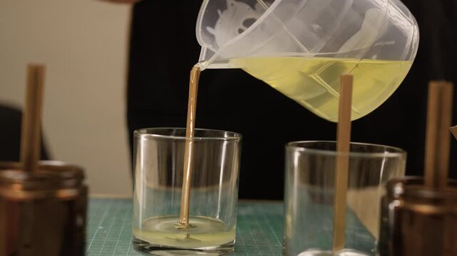 Creative hobby DIY candles at home. Candlemaker making aroma candle
