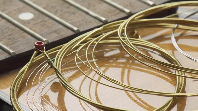 New guitar strings are ready to wind. Macro shot