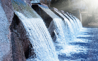 Water treatment plant releases clean water. Modern facility uses eco-friendly tech. Public water supply system works well. Safe drinking water resource. © Peter