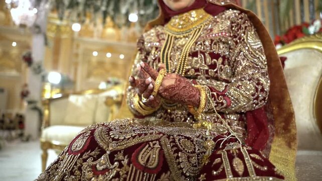 Close up view of bride dressed in traditional red Indian or Pakistan clothes, Elements of Arabic wedding