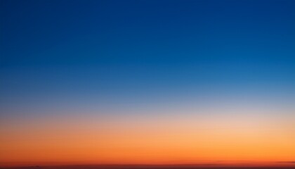Fototapeta premium Vertical Photo Of A Beautiful Clear Evening Sky Without Clouds Sky Gradient From Orange To Dark Blue