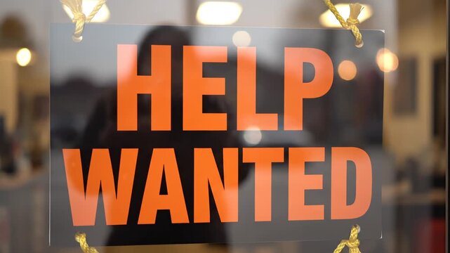 Help wanted sign on glass door