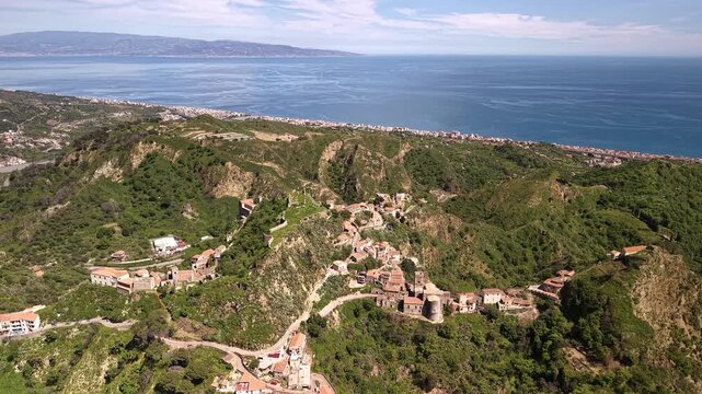 Pentefur Castle in Savoca Sicily surrounded by lush green hills and sea views