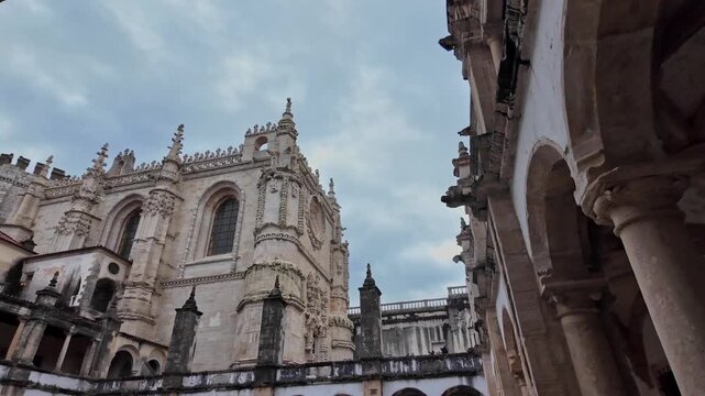 Historic Stone Architecture Of The Convent Of Christ In Tomar, Portugal. low angle, panning shot
