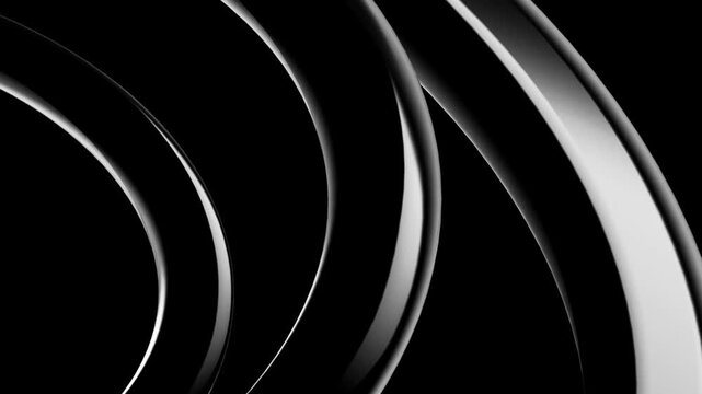 Abstract 3d render of sweeping glossy black metallic rings curving across a deep black background with dramatic highlights and smooth surfaces creating a sleek futuristic design composition