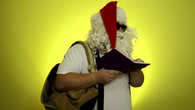 Santa Claus looking at long list with children desire