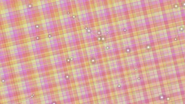 Vibrant plaid pattern with scattered rhinestones creating a festive atmosphere viewed from directly above