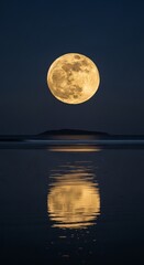 Full moon reflecting on calm ocean water at night