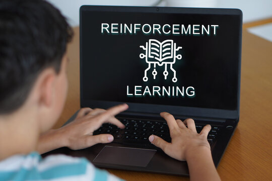 reinforcement learning. Digital safety and well-being in childhood and adolescence. Child typing on his laptop