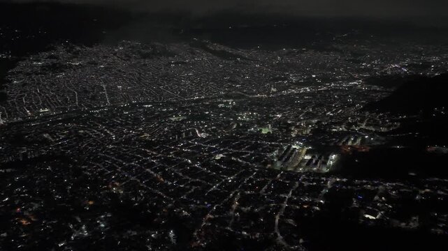 Cinematic aerial views of Medellin, Colombia captured from a scenic viewpoint overlooking the city. The footage showcases the urban landscape surrounded by green mountains in the Aburr&aacute; Valley, highli