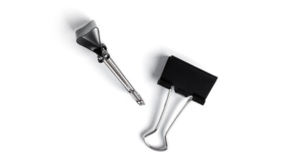 Black metal binder clips on white background. High quality photo