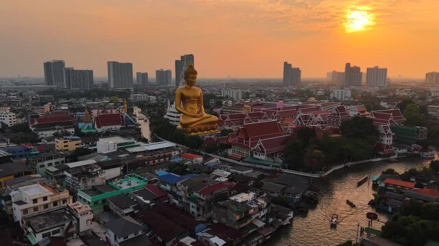 Aerial view of the Giant Golden Buddha in Wat Paknam Phasi Charoen Temple in Phasi Charoen district on Chao Phraya River sightseeing travel Bangkok. Thailand