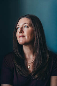Portrait of smiling attractive woman in her 50's with long hair.