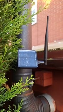 Vertical: Solar powered Meshcore repeater transmitter beacon broadcasting on stove pipe chimney