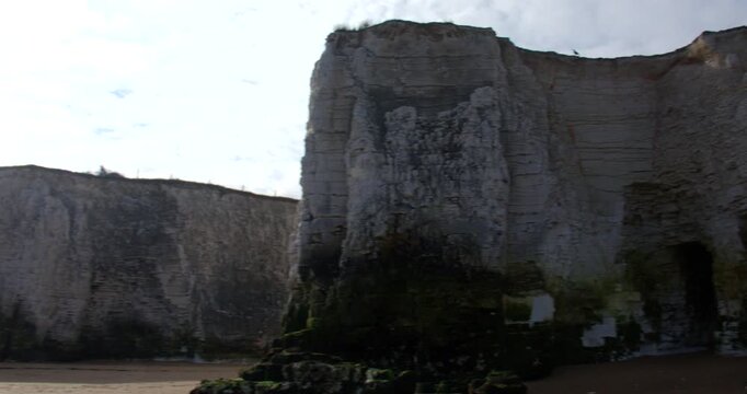 wide panning shot of the chalk stacks and cliffs on Botany Bay Beach at low tide. At marine Drive, Broadstairs
