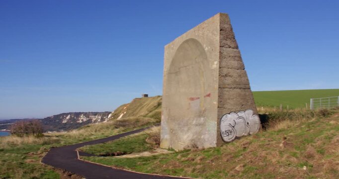 Wide panning shot right to left side on to the abbot's Cliff sound mirror. Next to Folkestone