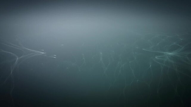 A dimly lit room with a faint source of light on the left side.