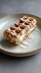 Delicious vanilla cream-filled waffle with sweet glaze on rustic plate