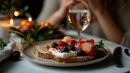 Delicious fruit-topped breakfast toast with berries and cream on elegant table setting