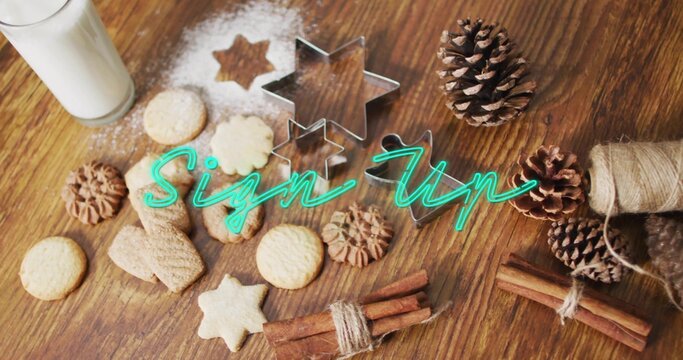 Displaying cookies, nested star cutters, cinnamon bundles, milk, teal Sign Up on wooden tabletop