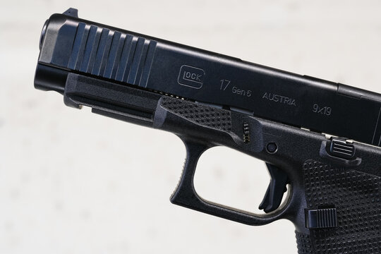 TALLINN, ESTONIA - FEBRUARY 18, 2026: Close-up view of the new Glock 17 Gen 6 9x19 pistol, showing detailed frame texture.