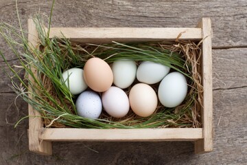 a rustic wooden crate filled with fresh eggs