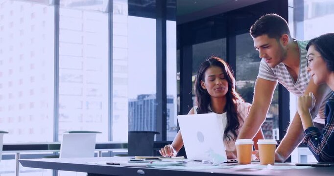Seated woman typing laptop, man placing coffee and pointing at code overlay, colleagues fixing bug