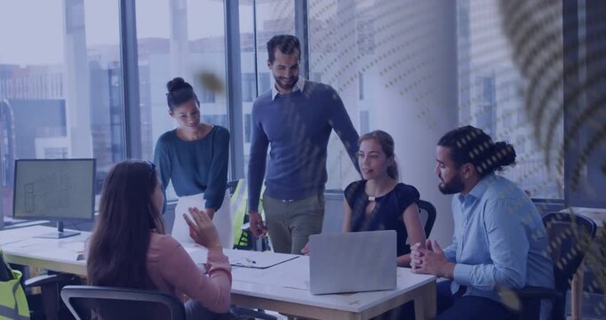 Business team reacting after woman at laptop pointing, reviewing project, patterned overlay moving