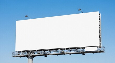 Obraz premium Large Outdoor Billboard Displaying Blank Advertising Against Clear Blue Sky With Bright Overhead Spotlights