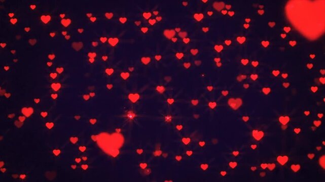 Red Hearts Falling Against Dark Background.