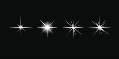 Fototapeta premium A series of four bright white stars against a black background