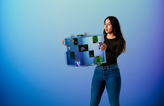 3D Modular Garden Cube held in woman hands with digital panels