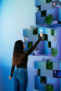 3D Vertical Eco System with woman interacting with tech cubes